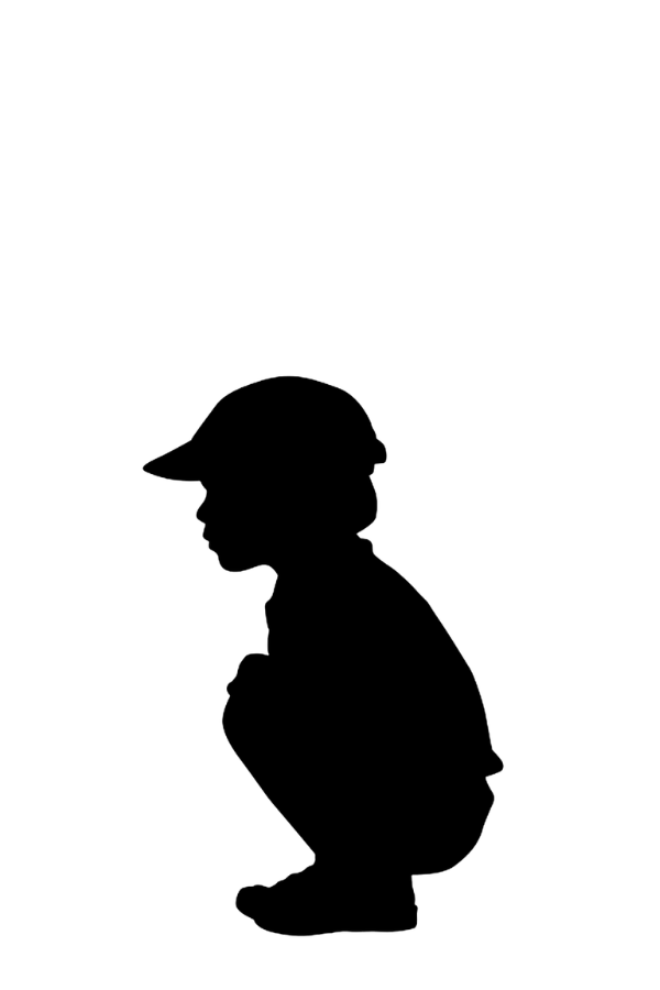 A silhouette of a boy in cap crouching.