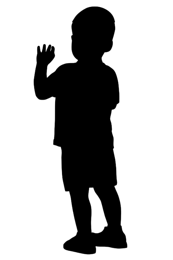 A silhouette of a boy with his arm up waving.