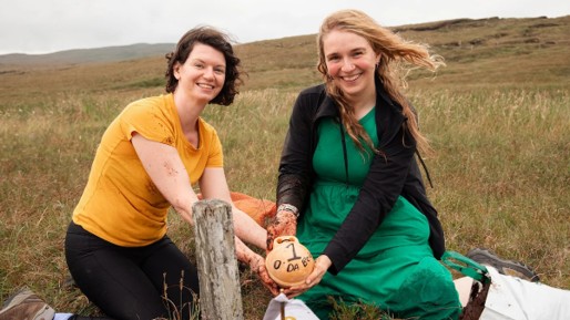 Aidan Nicol and Jenny Watt planting bog butter during O Da Bog. Image: Shetland Arts