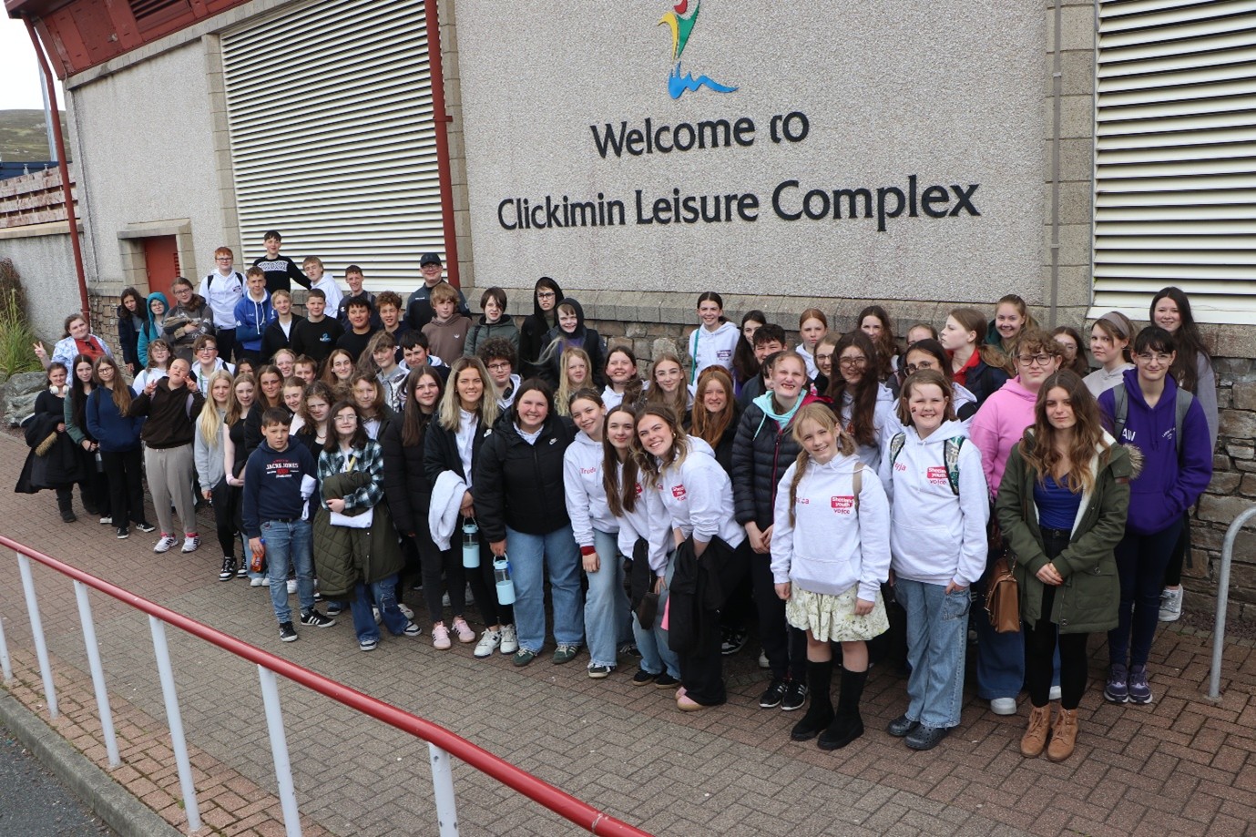 A group of people who are part of Shetland Youth Voice standing for a photo.